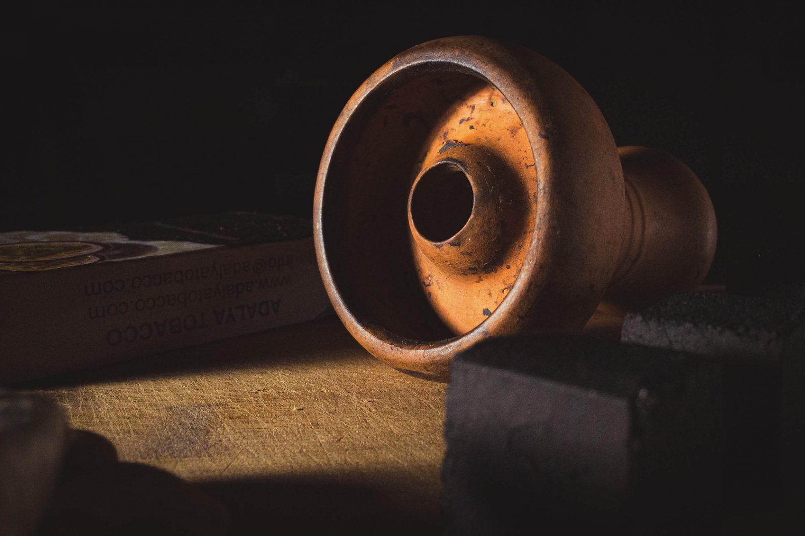 Traditional hookah bowl in warm evening light